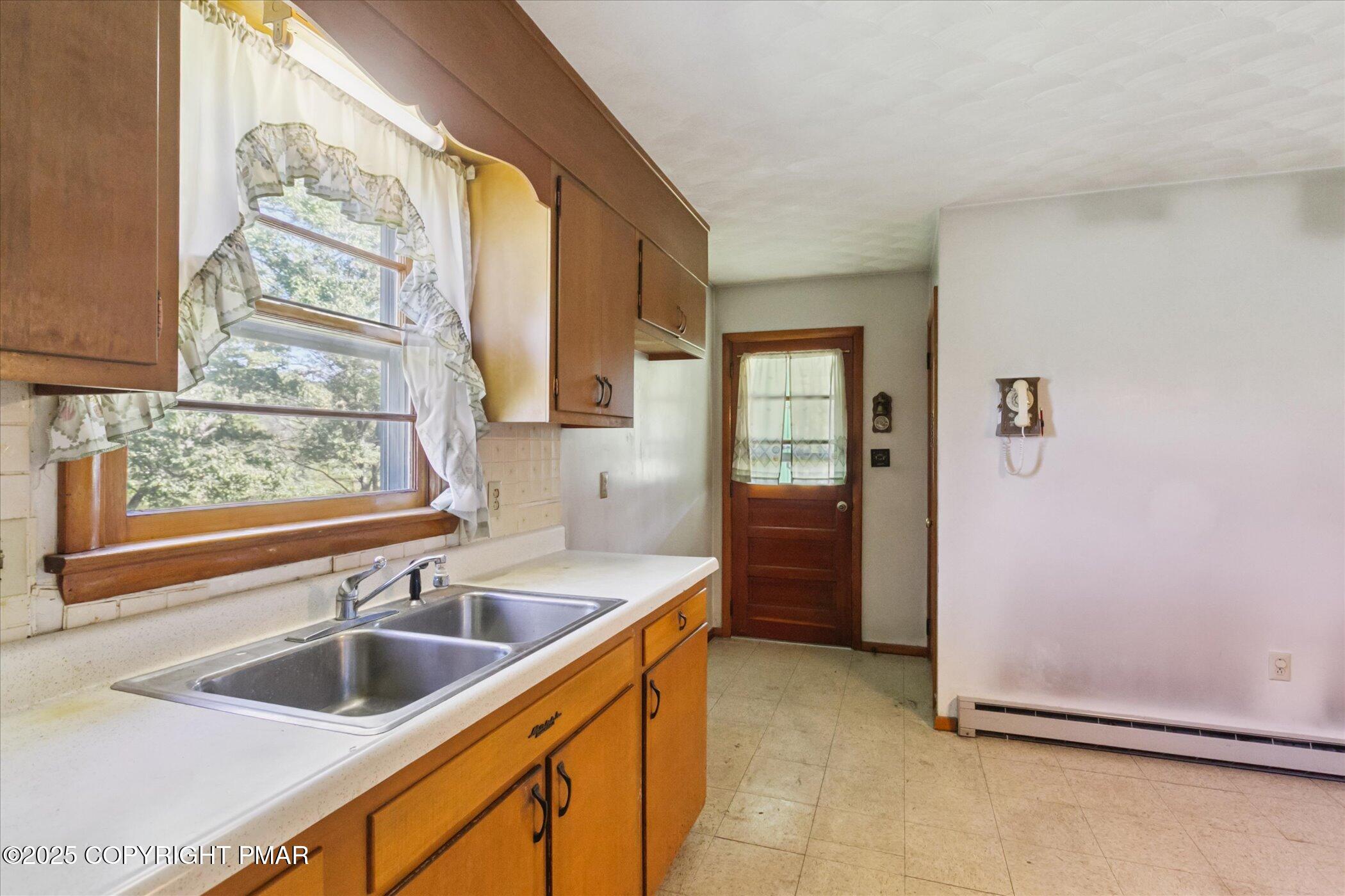 145 Sweet Arrow Lake Road Pine Grove, PA 17963 - Photo 15 of 38 a kitchen with a sink and large window
