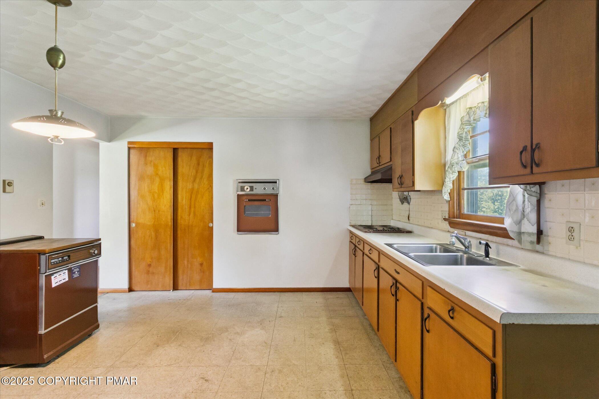 145 Sweet Arrow Lake Road Pine Grove, PA 17963 - Photo 16 of 38 a kitchen with stainless steel appliances granite countertop a sink stove and refrigerator