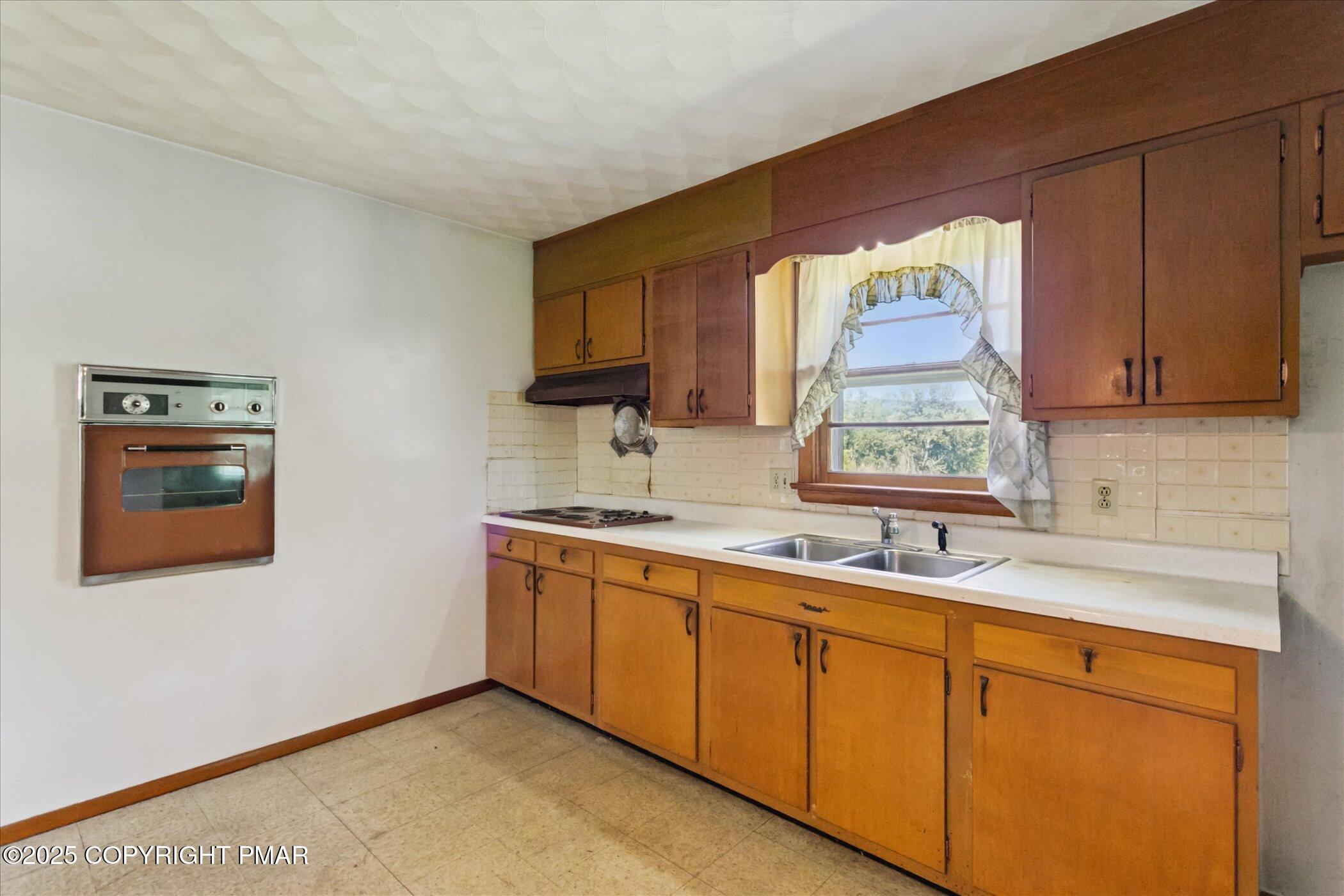 145 Sweet Arrow Lake Road Pine Grove, PA 17963 - Photo 17 of 38 a kitchen with stainless steel appliances granite countertop a sink and a microwave