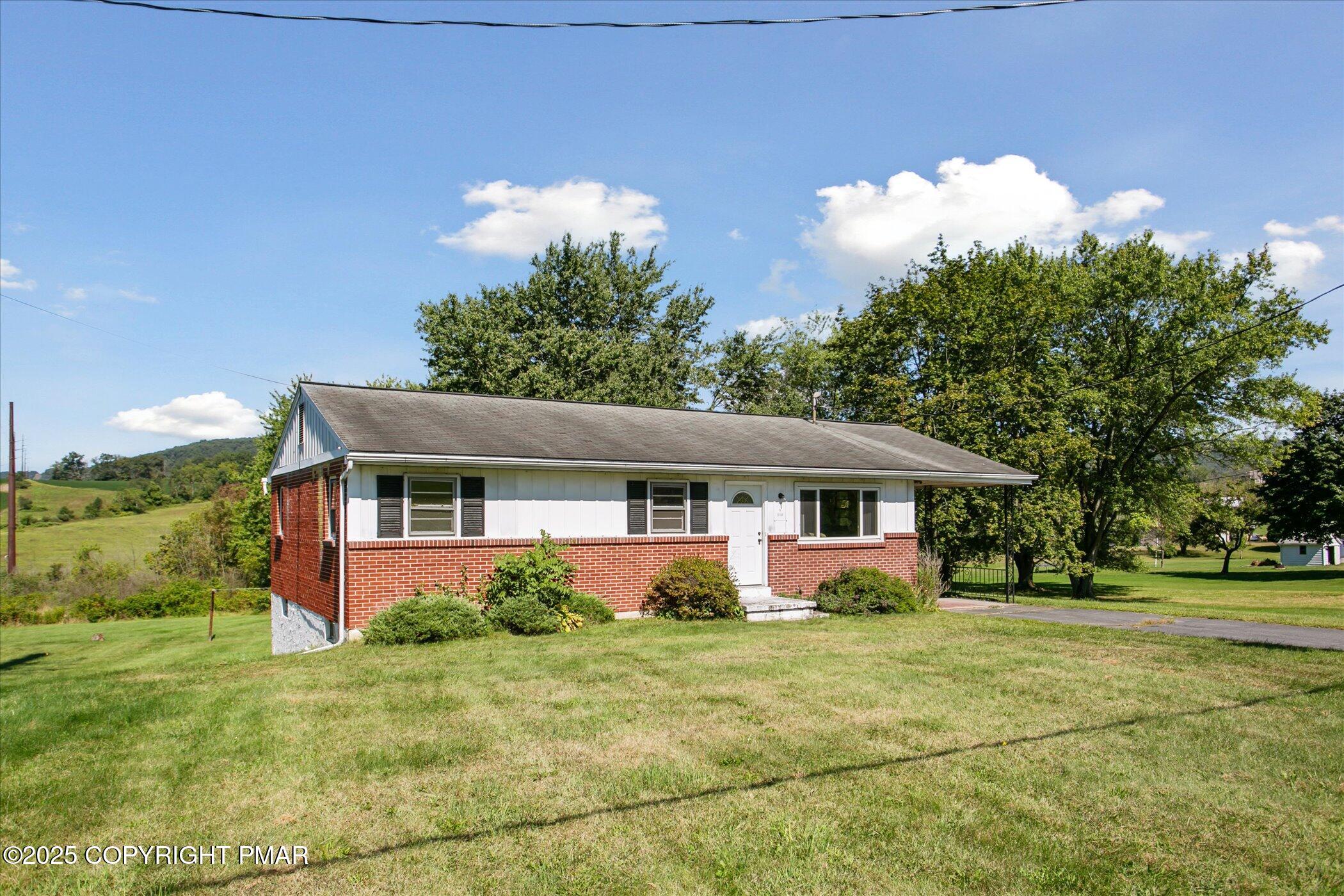 145 Sweet Arrow Lake Road Pine Grove, PA 17963 - Photo 2 of 38 a front view of house with yard and green space