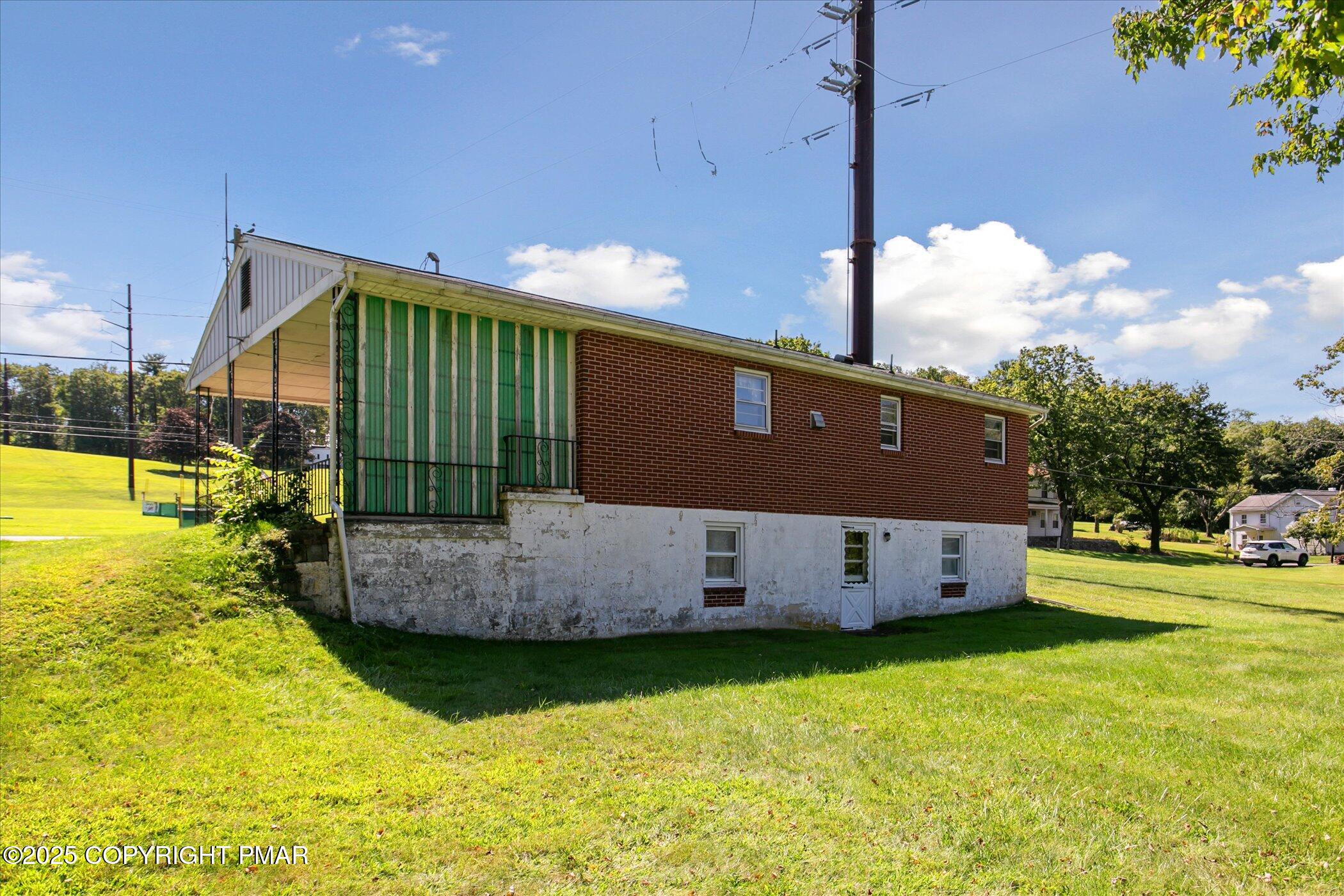 145 Sweet Arrow Lake Road Pine Grove, PA 17963 - Photo 30 of 38 a front view of house with yard and trees