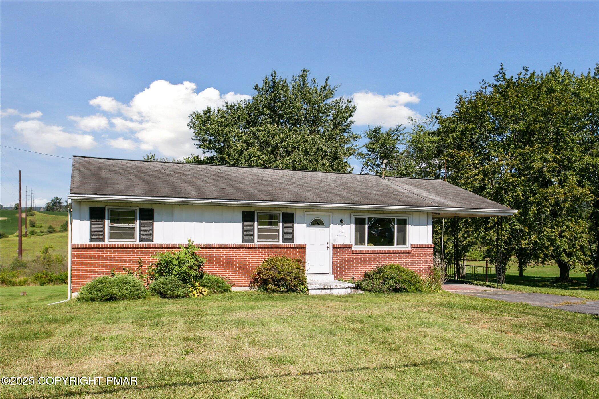 145 Sweet Arrow Lake Road Pine Grove, PA 17963 - Photo 3 of 38 front view of a house with a yard