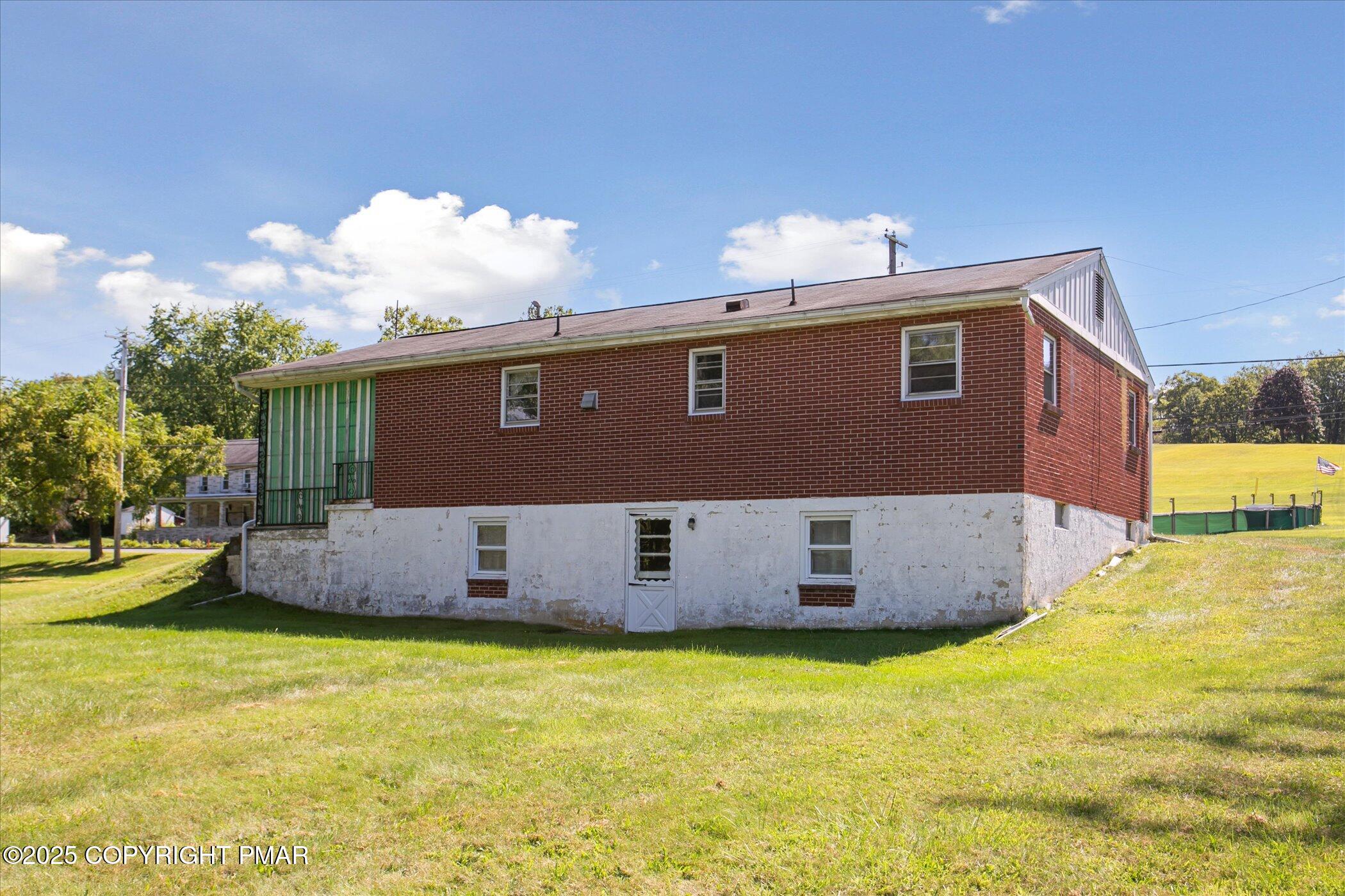 145 Sweet Arrow Lake Road Pine Grove, PA 17963 - Photo 33 of 38 a view of a house with backyard and sitting area