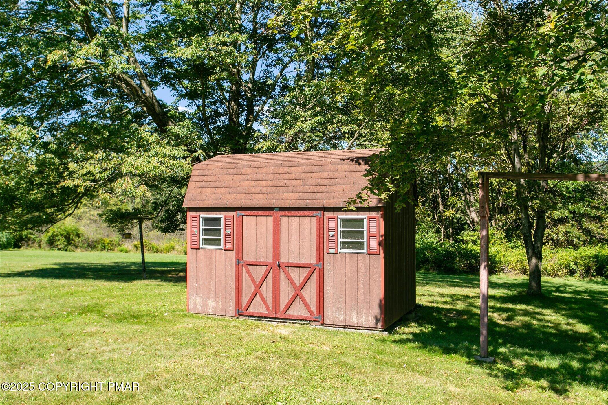 145 Sweet Arrow Lake Road Pine Grove, PA 17963 - Photo 35 of 38 a backyard of a house with lots of green space