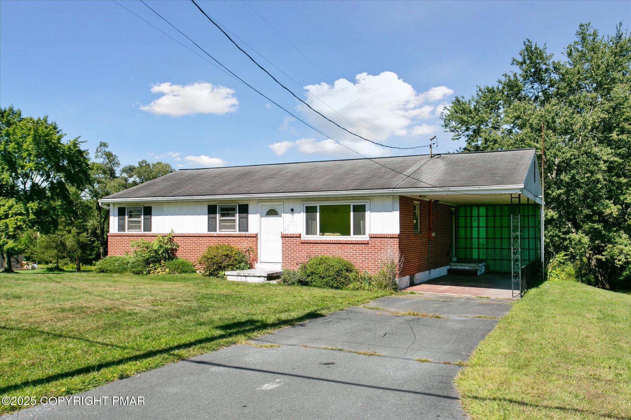 145 Sweet Arrow Lake Road Pine Grove, PA 17963 - Photo 6 of 38 a front view of a house with garden