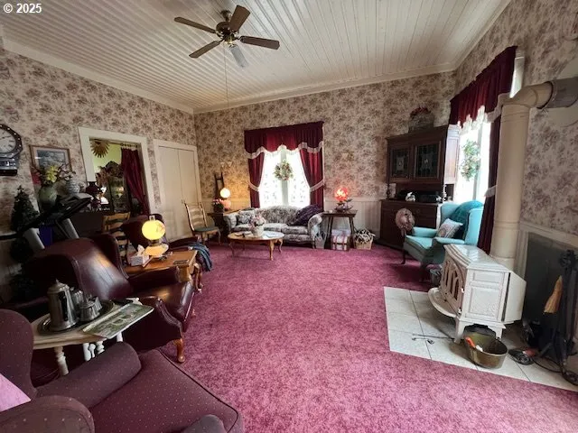 a living room with furniture a window and gym equipment