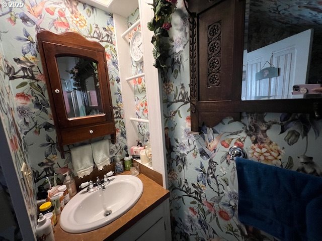 18 South Collier Street Coquille, OR 97423 - Photo 20 of 48 a bathroom with a sink and a mirror
