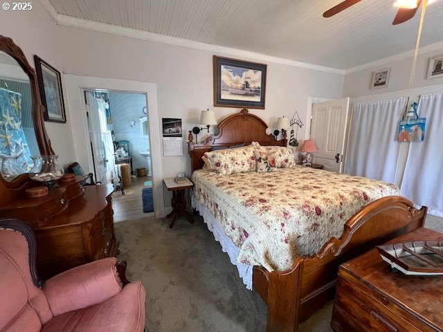 18 South Collier Street Coquille, OR 97423 - Photo 25 of 48 a bed sitting in a bedroom next to a window with tv