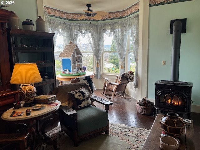 18 South Collier Street Coquille, OR 97423 - Photo 34 of 48 a living room with furniture a fireplace and a chandelier