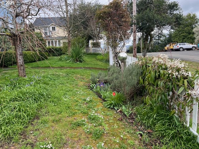 18 South Collier Street Coquille, OR 97423 - Photo 47 of 48 a view of a building with garden and trees