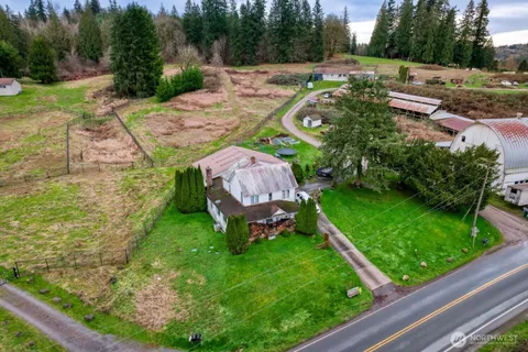 a view of an house with backyard space and garden