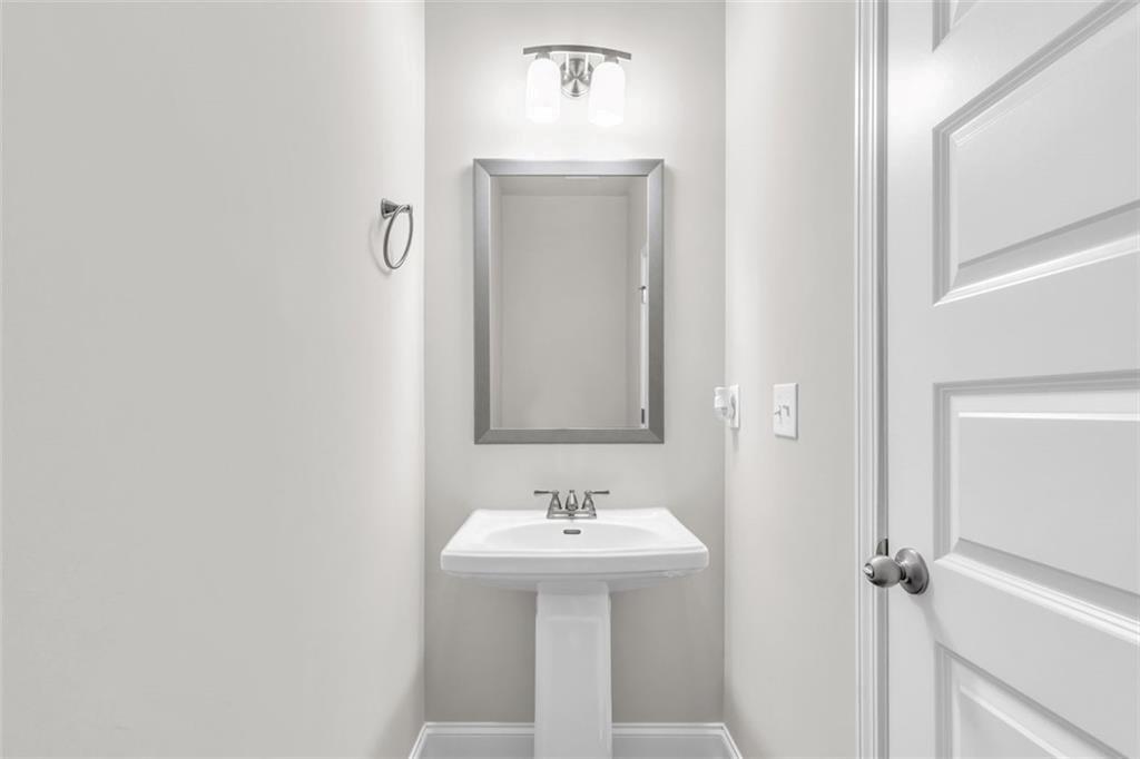 2340 Manor Pointe Drive Cumming, GA 30041 - Photo 15 of 45 a bathroom with a sink and a mirror
