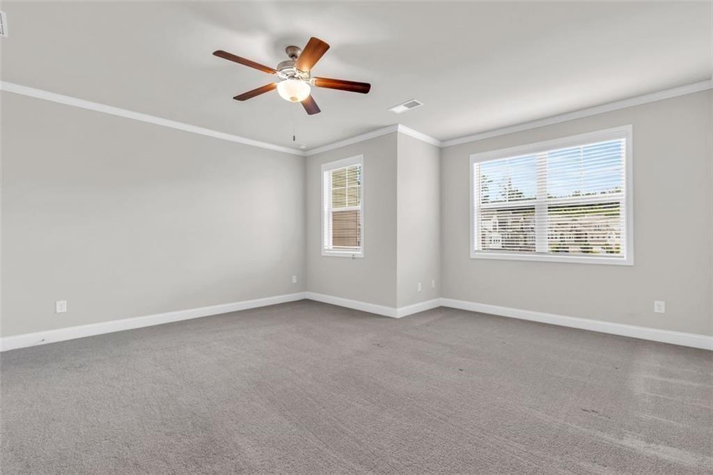 2340 Manor Pointe Drive Cumming, GA 30041 - Photo 21 of 45 a view of an empty room with a window