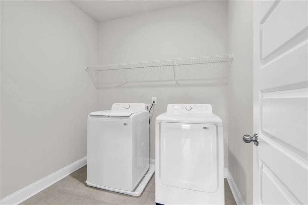 2340 Manor Pointe Drive Cumming, GA 30041 - Photo 28 of 45 a utility room with dryer and washer