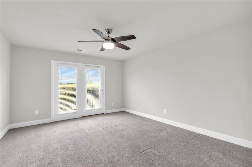 2340 Manor Pointe Drive Cumming, GA 30041 - Photo 36 of 45 a view of an empty room with a window