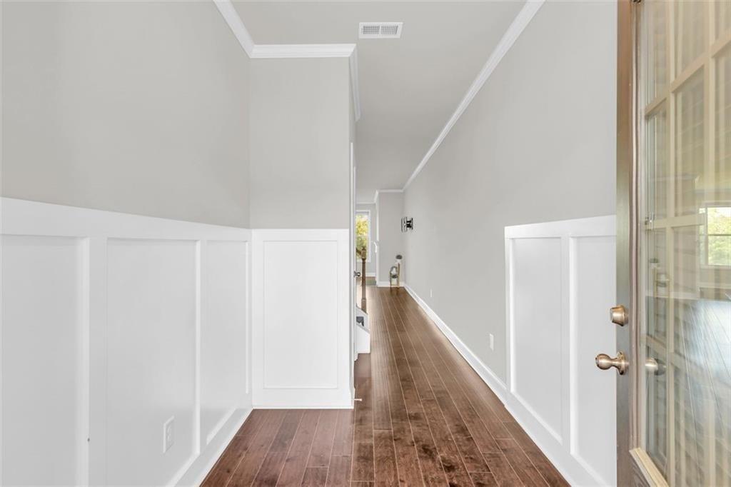 2340 Manor Pointe Drive Cumming, GA 30041 - Photo 4 of 45 a view of a hallway with wooden floor and entryway