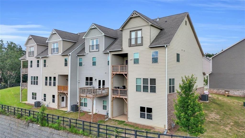 2340 Manor Pointe Drive Cumming, GA 30041 - Photo 41 of 45 a view of a white building among the street view