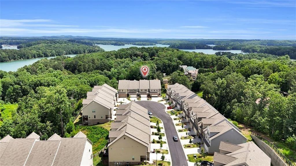 2340 Manor Pointe Drive Cumming, GA 30041 - Photo 42 of 45 a view of a city with lush green forest