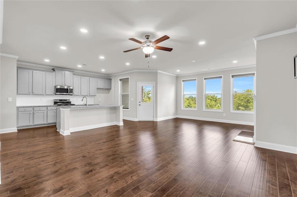 2340 Manor Pointe Drive Cumming, GA 30041 - Photo 6 of 45 a view of an empty room with kitchen and window