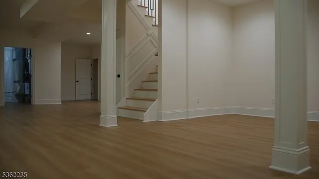a view of an entryway with wooden floor