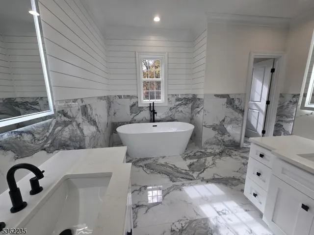 a bathroom with a sink and mirror