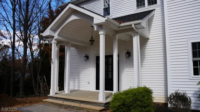 a view of a small house with a door and wooden floor