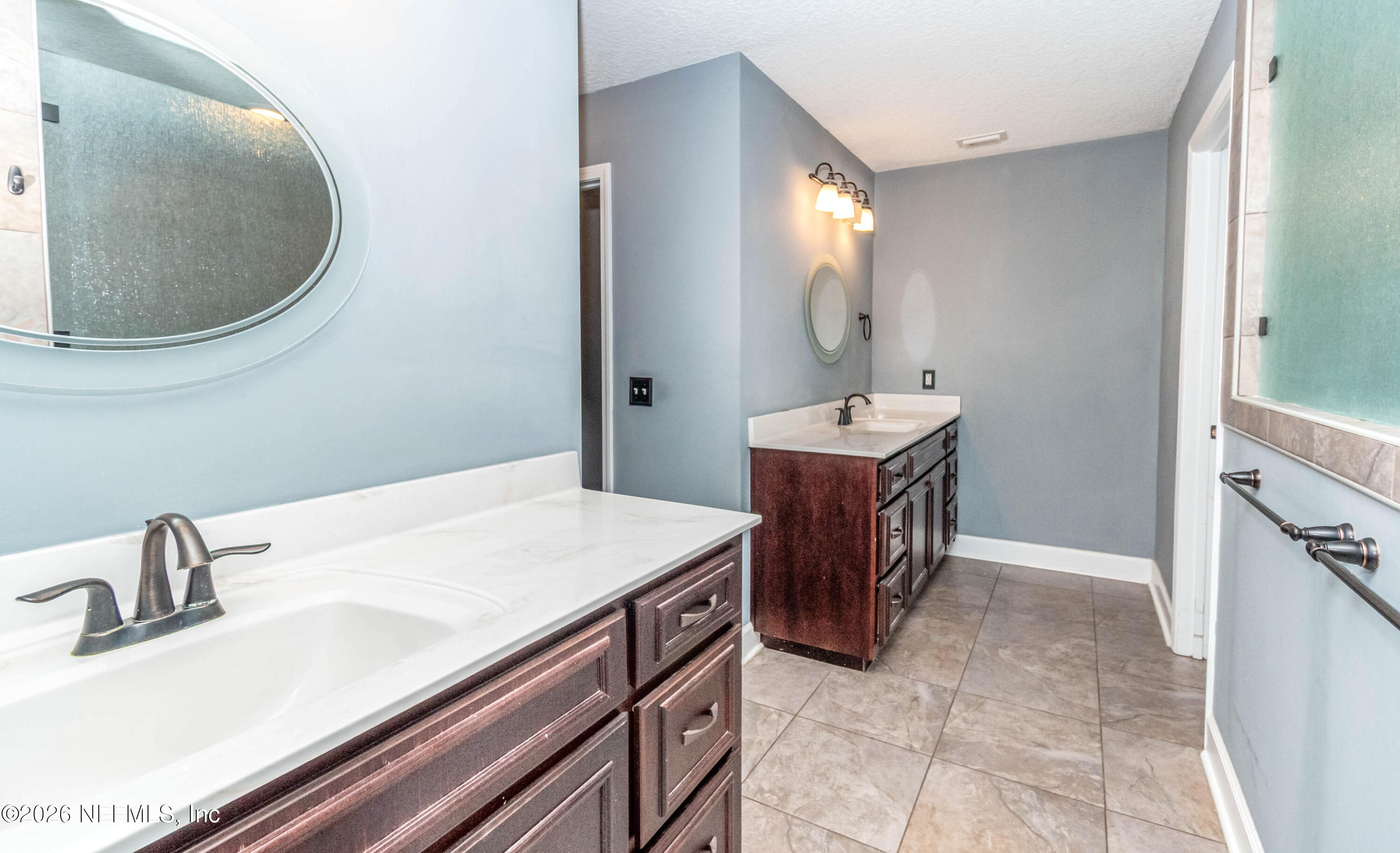 18100 Crews Road Glen St. Mary, FL 32040 - Photo 32 of 86 Master bathroom his and her vanities