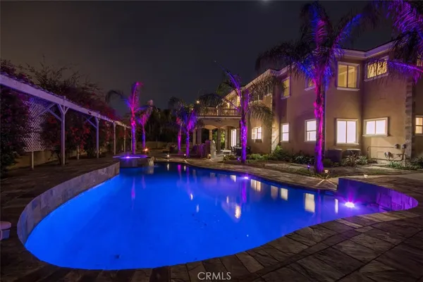 a view of swimming pool with outdoor seating
