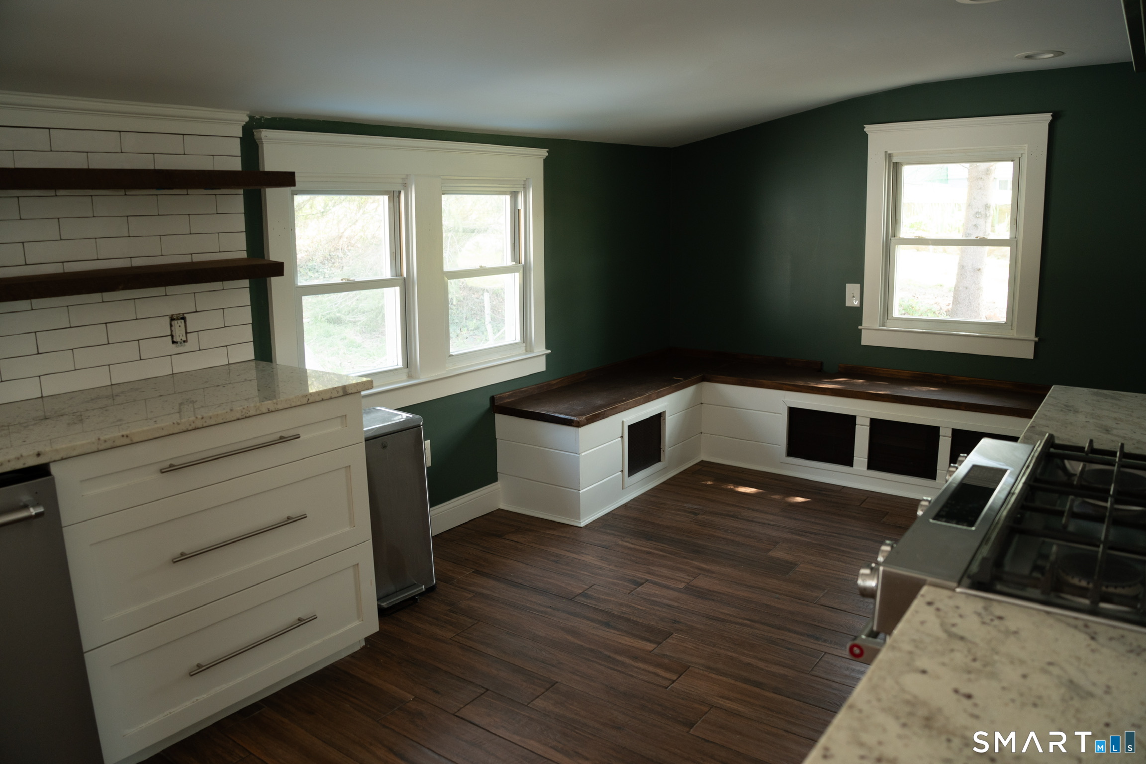 97 Candlewood Road Groton, CT 06340 - Photo 11 of 26 a kitchen with a stove a sink and wooden floor