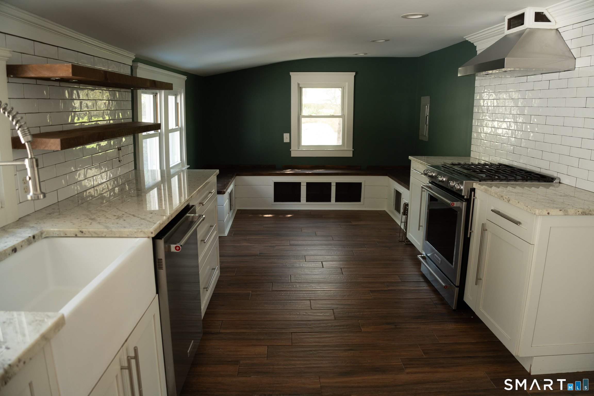 97 Candlewood Road Groton, CT 06340 - Photo 12 of 26 a kitchen with granite countertop a stove and a sink