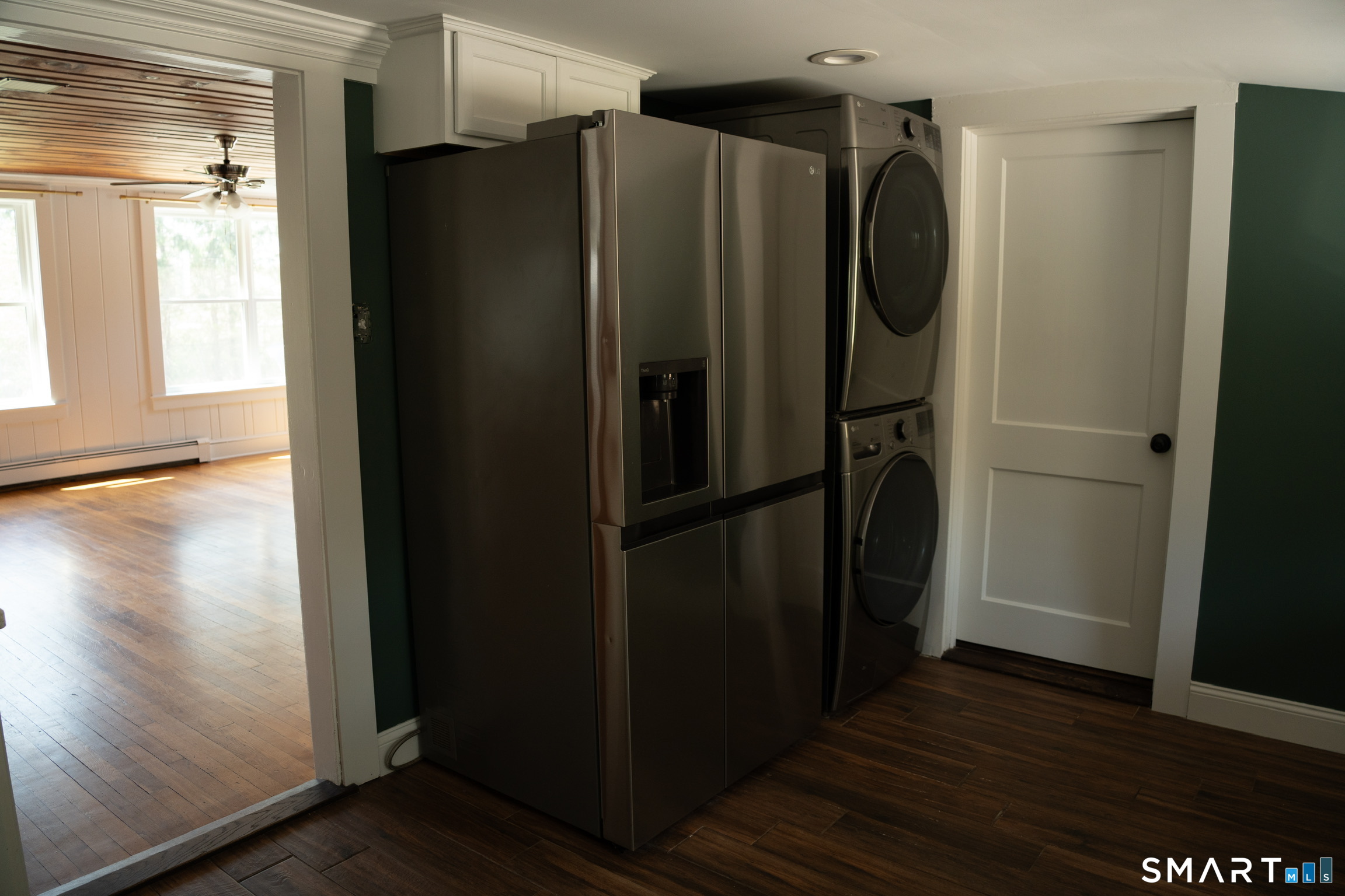 97 Candlewood Road Groton, CT 06340 - Photo 13 of 26 a metallic refrigerator freezer sitting inside of a kitchen
