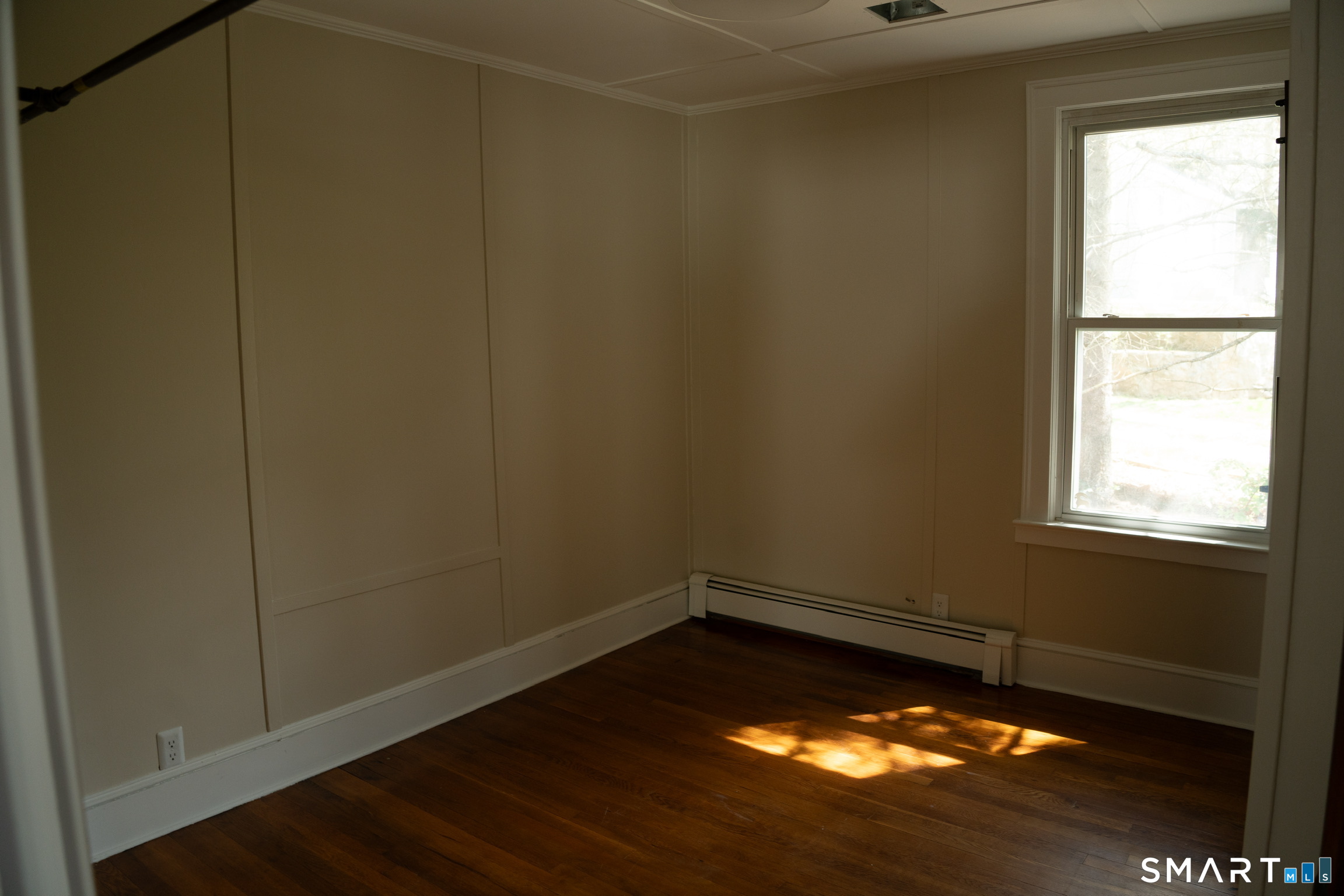 97 Candlewood Road Groton, CT 06340 - Photo 18 of 26 a view of a room with wooden floor and a window