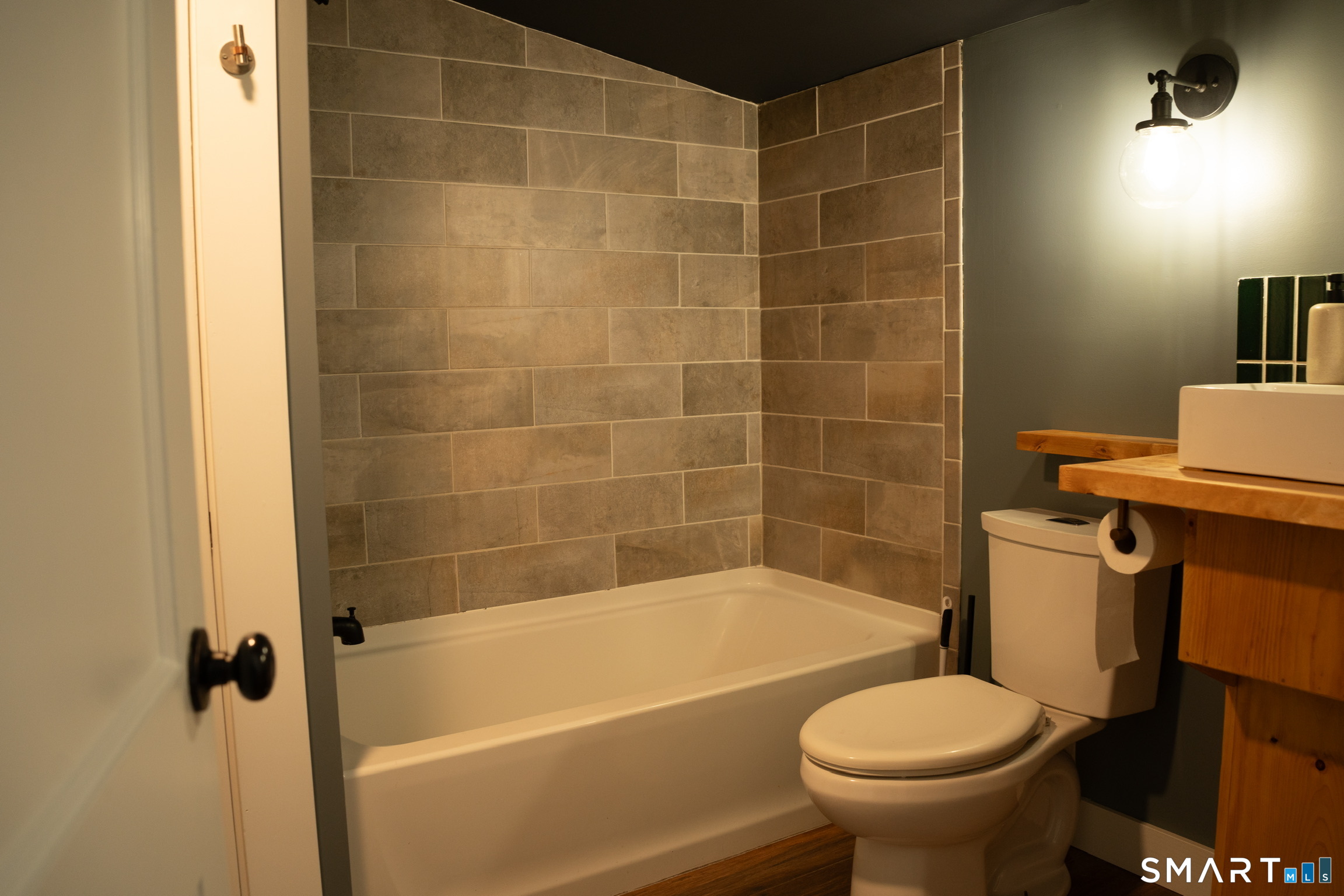 97 Candlewood Road Groton, CT 06340 - Photo 20 of 26 a bathroom with a sink and a bathtub