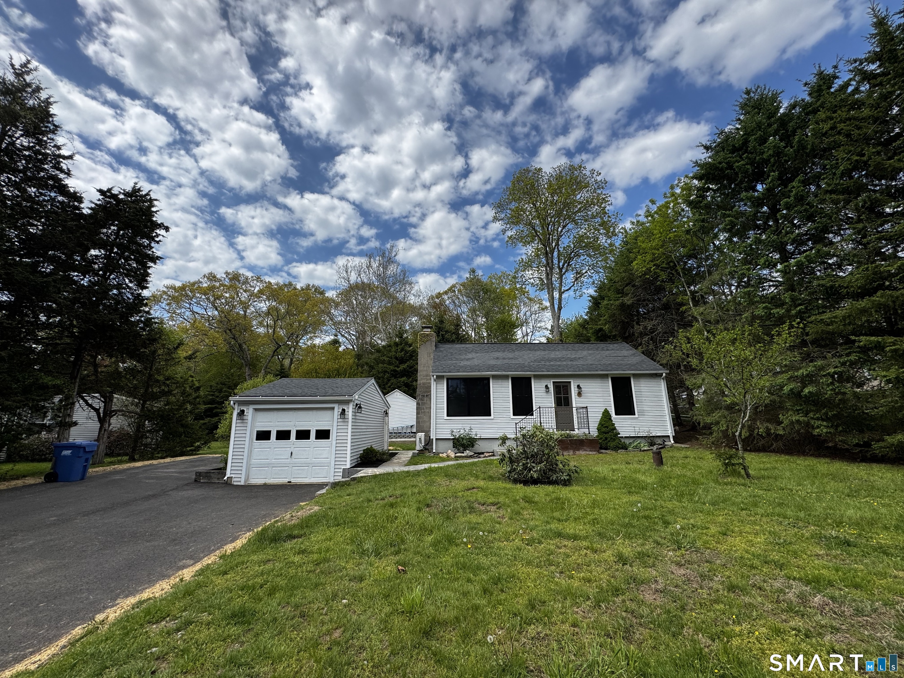 97 Candlewood Road Groton, CT 06340 - Photo 2 of 26 a front view of a house with garden