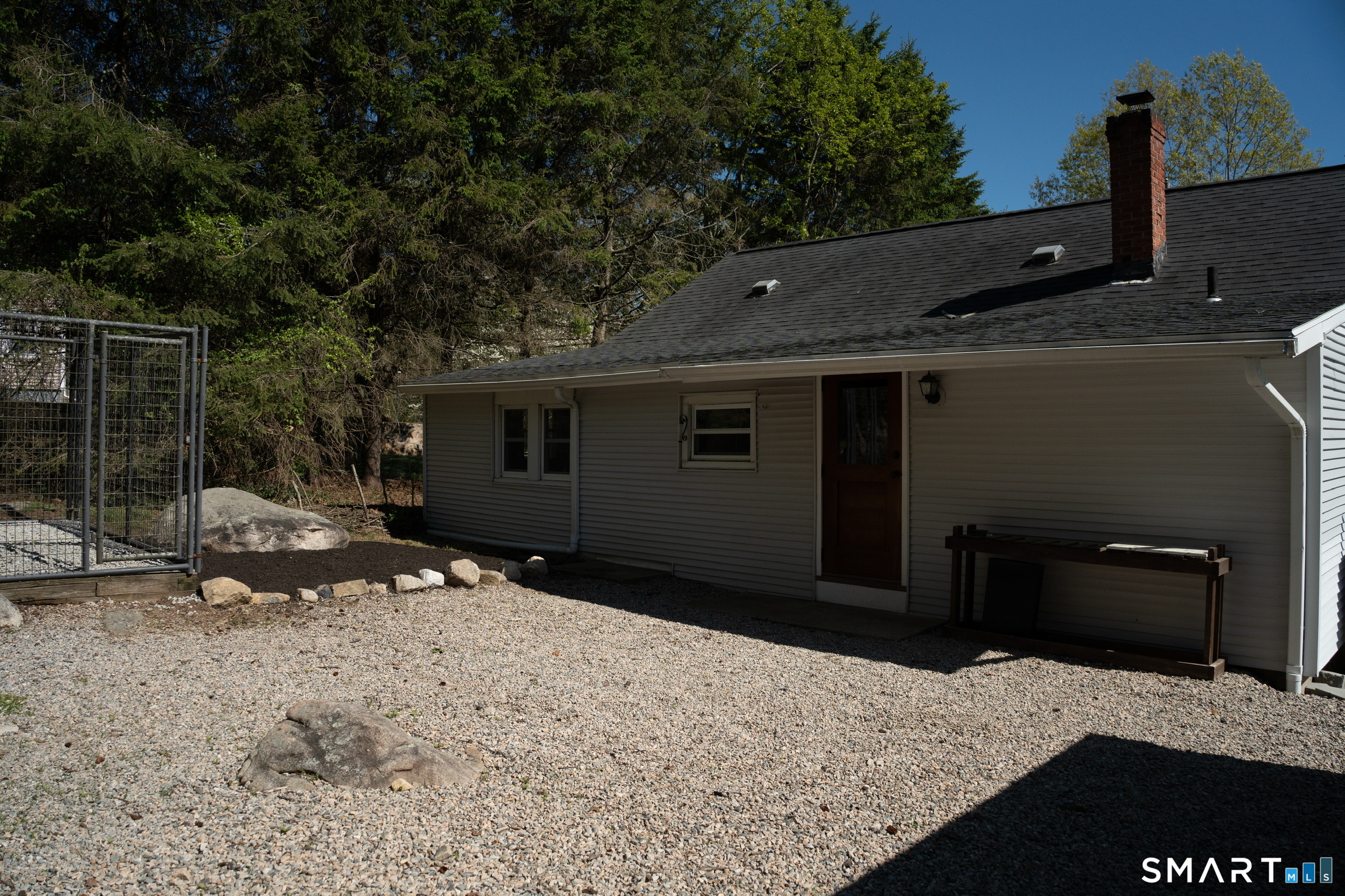 97 Candlewood Road Groton, CT 06340 - Photo 21 of 26 a backyard of a house with a large tree