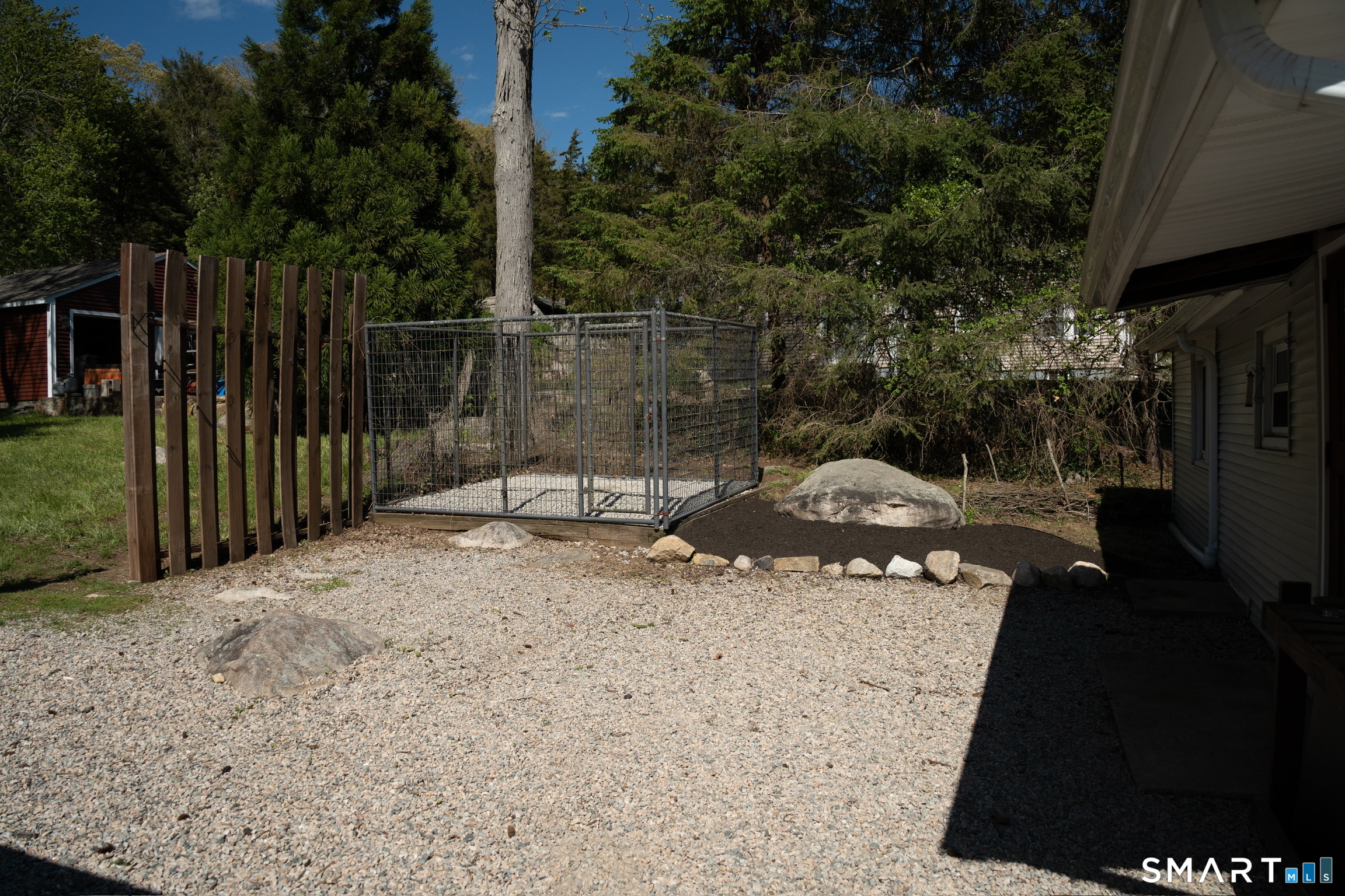 97 Candlewood Road Groton, CT 06340 - Photo 24 of 26 a backyard of a house with shaded area