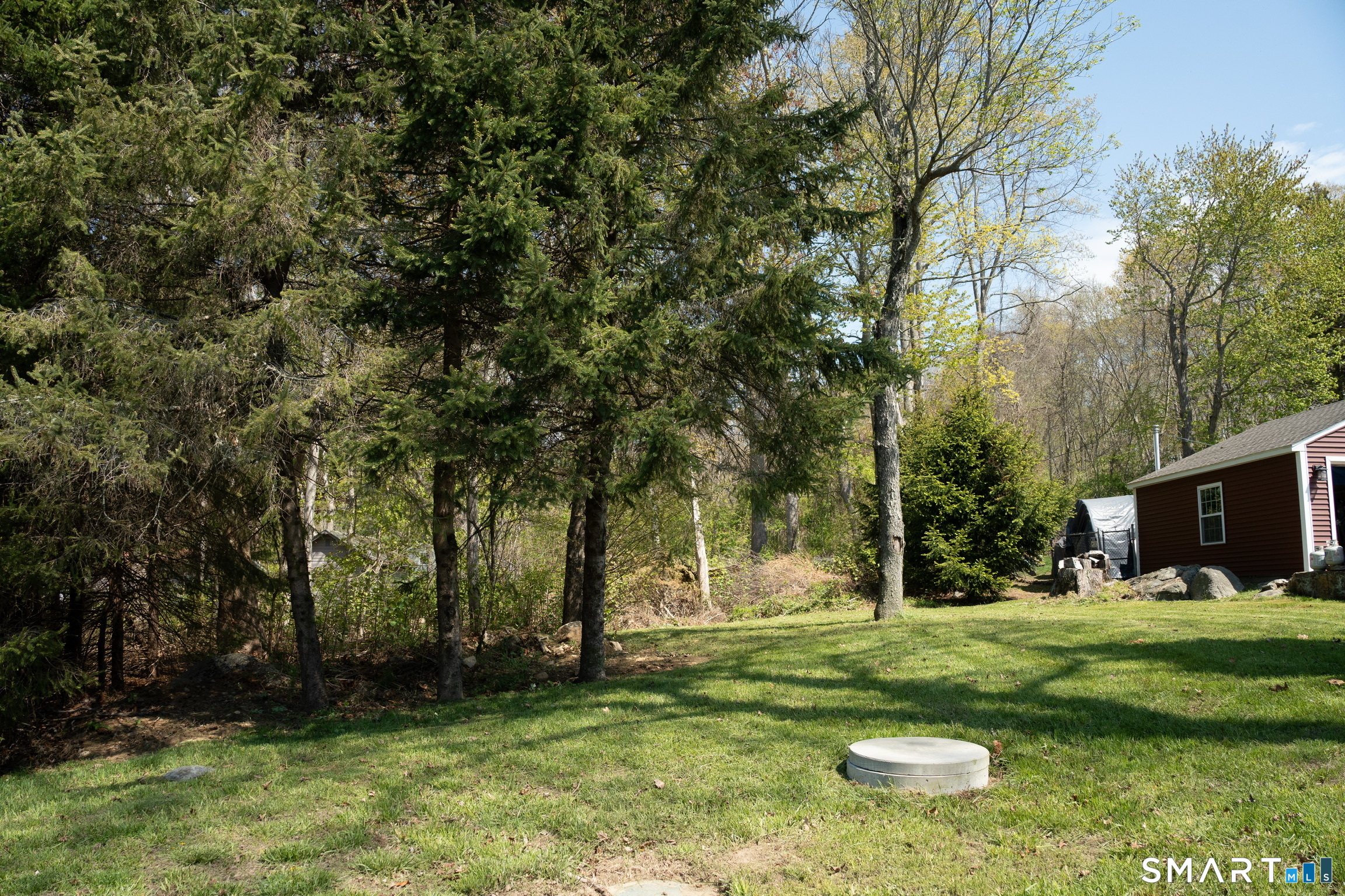 97 Candlewood Road Groton, CT 06340 - Photo 26 of 26 a view of a tree in front of a house