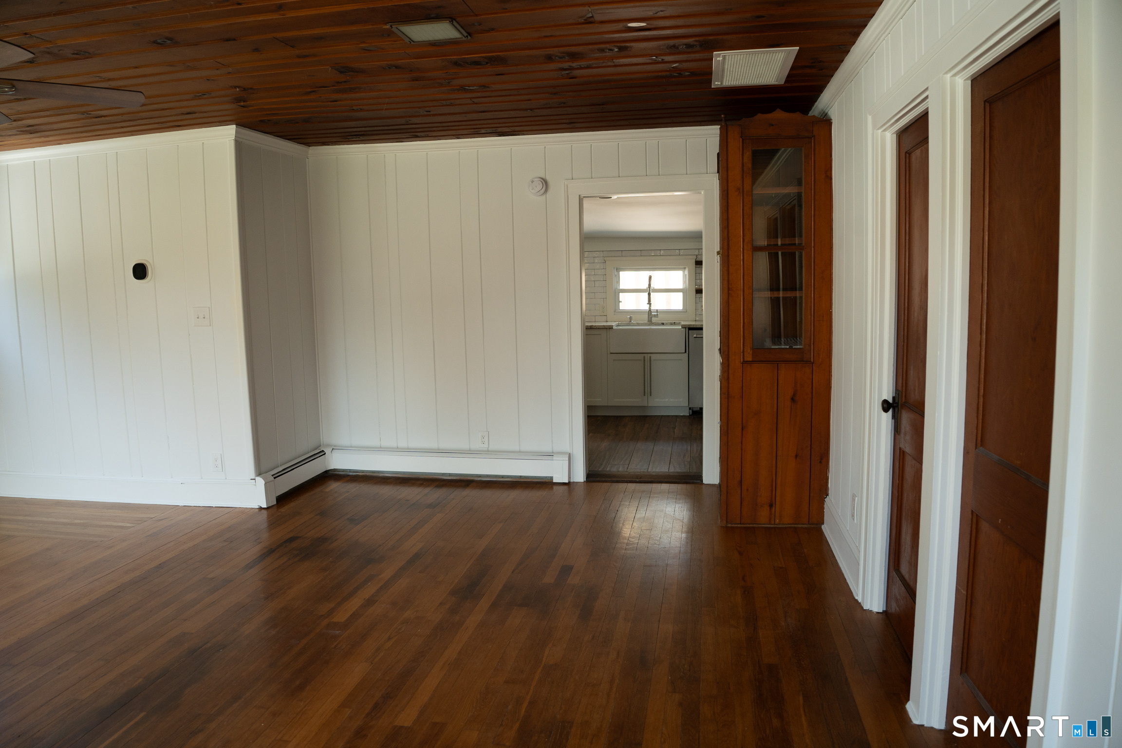 97 Candlewood Road Groton, CT 06340 - Photo 6 of 26 a view of a hallway with wooden floor