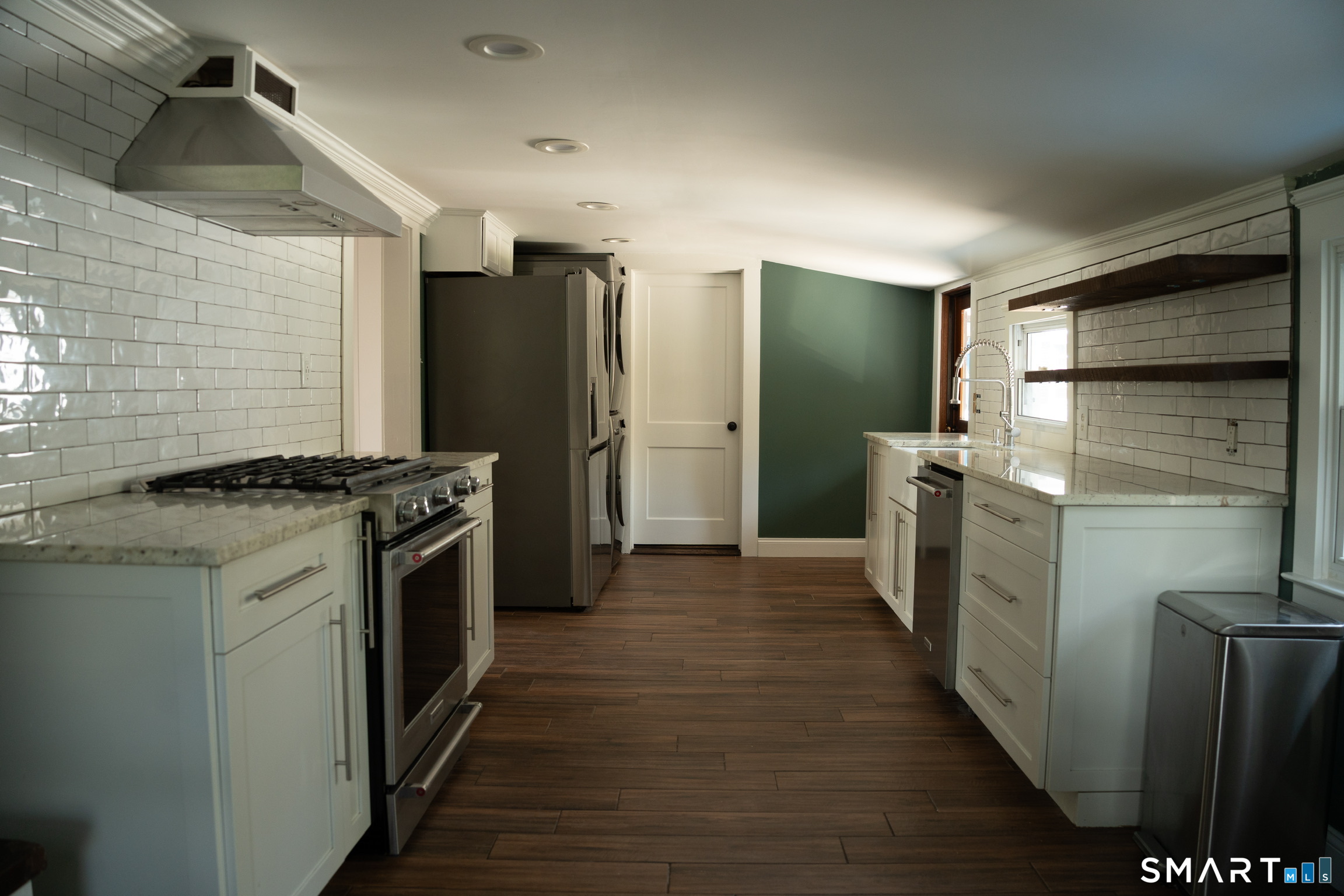 97 Candlewood Road Groton, CT 06340 - Photo 9 of 26 a kitchen with stainless steel appliances granite countertop a refrigerator a stove and a sink