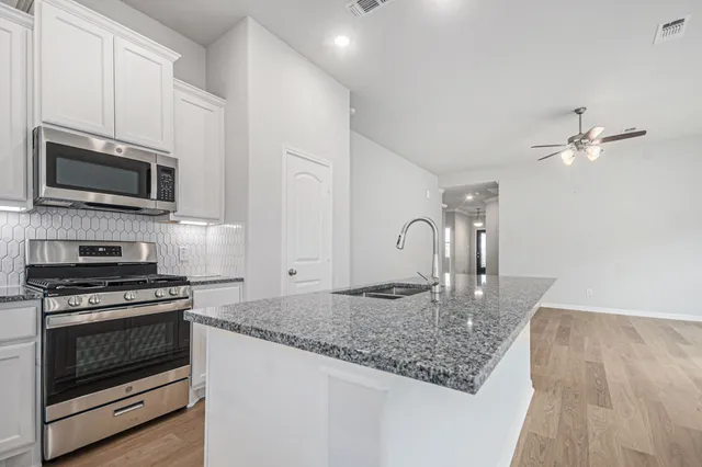 a view of a livingroom with wooden floor