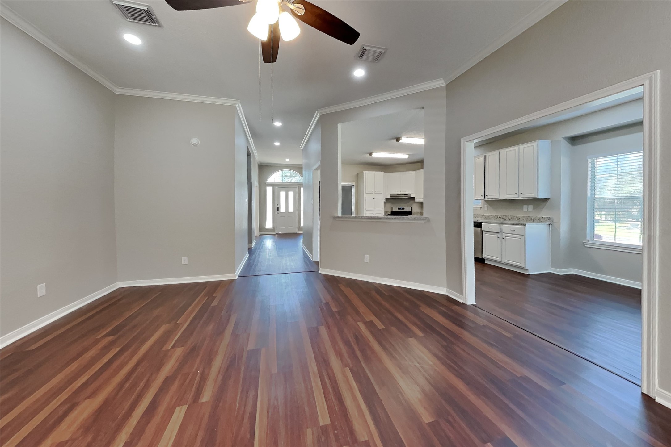 8615 Mile Run Road Humble, TX 77346 - Photo 2 of 19 wooden floor in an empty room with a window