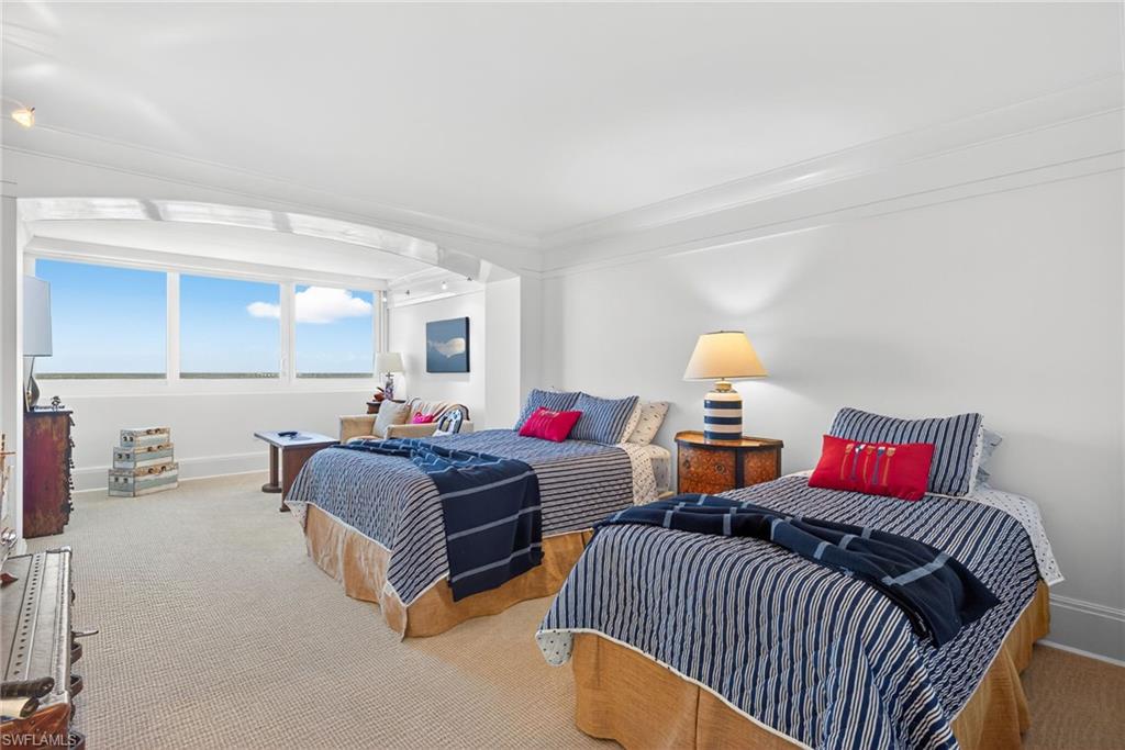 5601 Turtle Bay Drive, Unit 2104 Naples, FL 34108 - Photo 14 of 31 Bedroom with carpet and crown molding