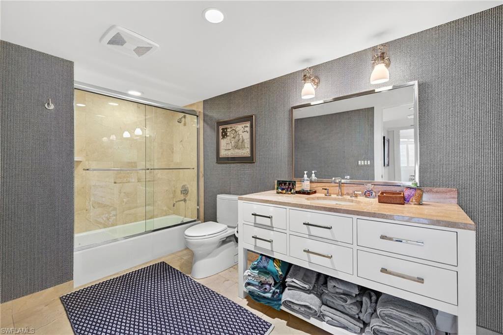 5601 Turtle Bay Drive, Unit 2104 Naples, FL 34108 - Photo 16 of 31 Bathroom featuring shower / bath combination with glass door, vanity, and recessed lighting