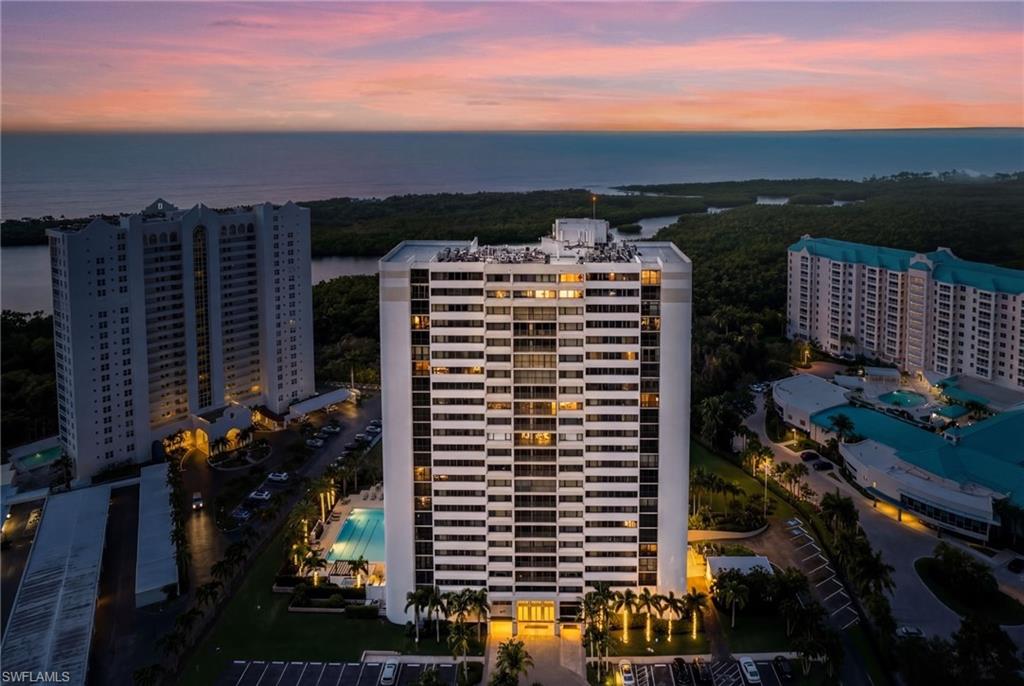5601 Turtle Bay Drive, Unit 2104 Naples, FL 34108 - Photo 28 of 31 Drone / aerial view of apartment complex / building and a large body of water