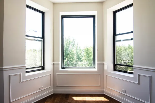 a view of a bathtub in a room with a window