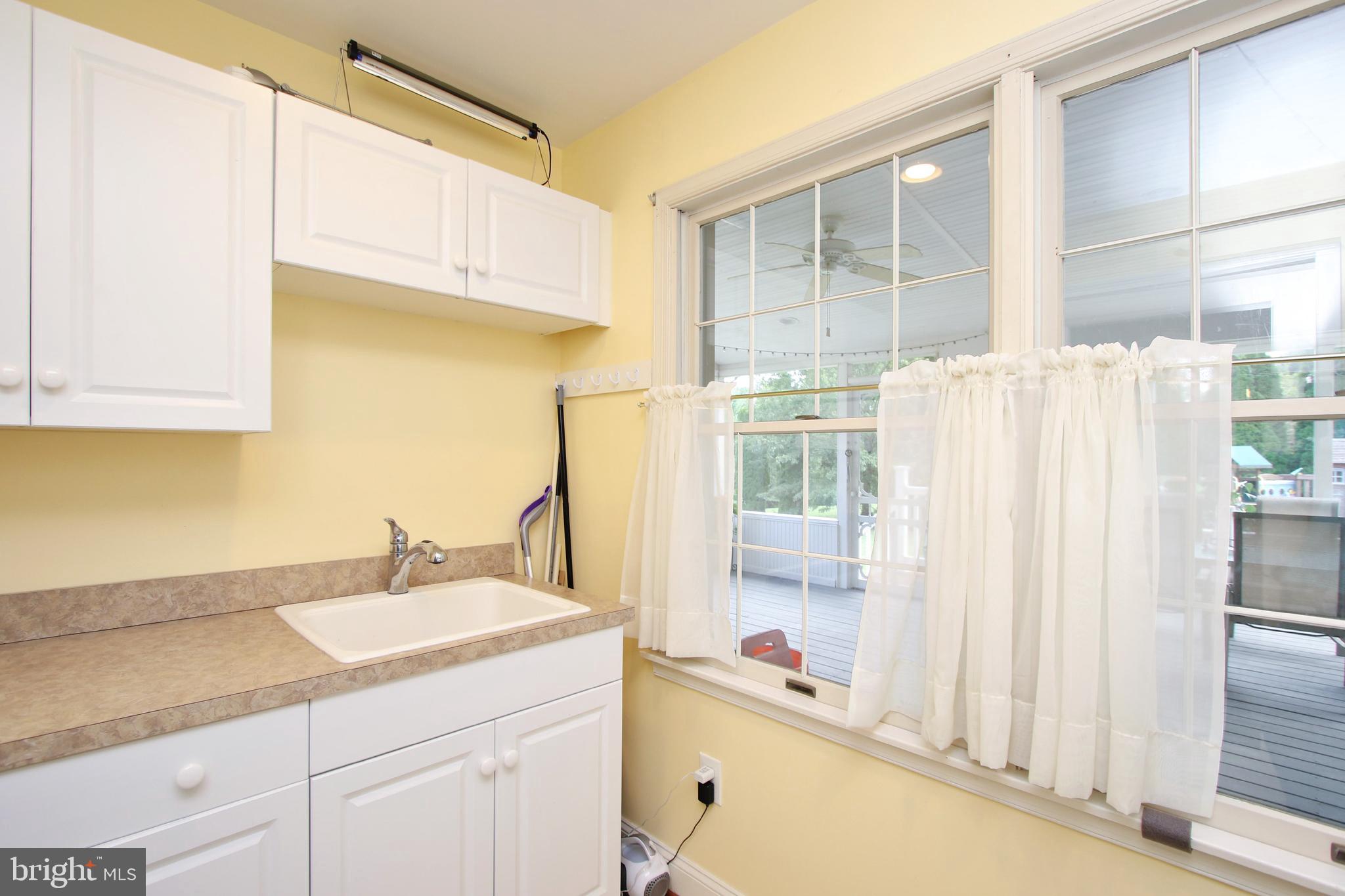 16455 Old Frederick Road Mount Airy, MD 21771 - Photo 22 of 45 Laundry room with lots of cabinets