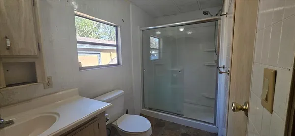 a kitchen with a sink appliances and cabinets