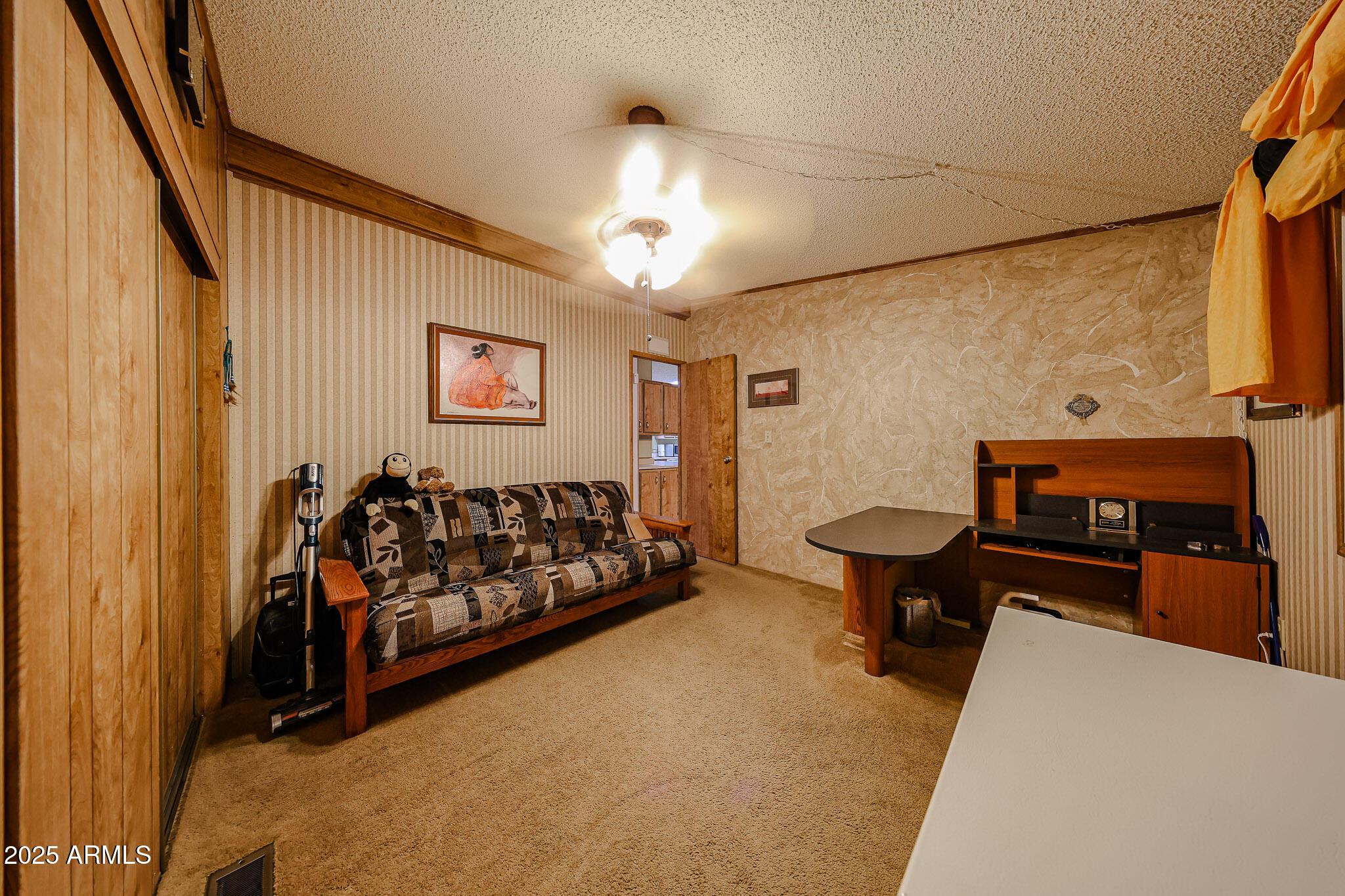 3901 East Pinnacle Peak Road, Unit 208 Phoenix, AZ 85050 - Photo 13 of 22 a bed room with a bed and a couch