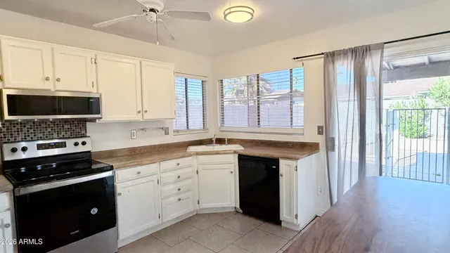 a kitchen with a sink and a window