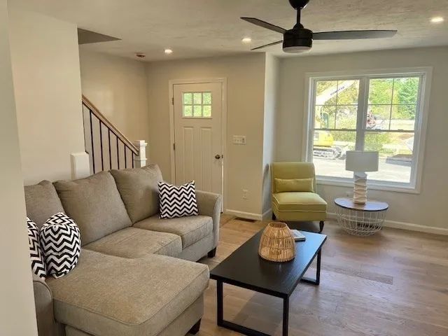 a living room with furniture and a window